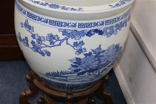 Two Chinese blue and white fish bowls on stands